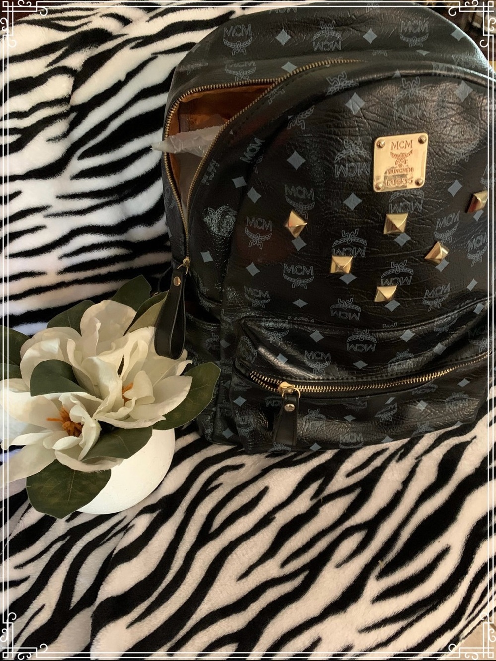 MCM Black Logo Studded Backpack with Gold Accents UNISEX